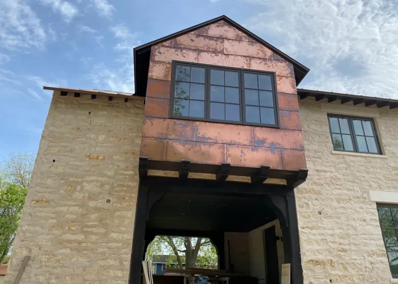 Copper metal panel facade on a stone building for Roof Repair in Carpinteria