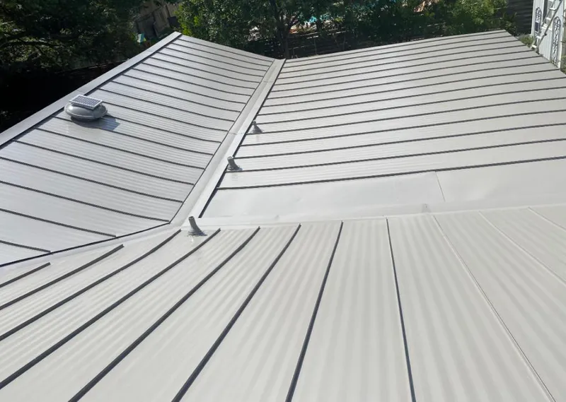 Solar attic fan installed on a metal roof for Roof Ventilation in Carpinteria